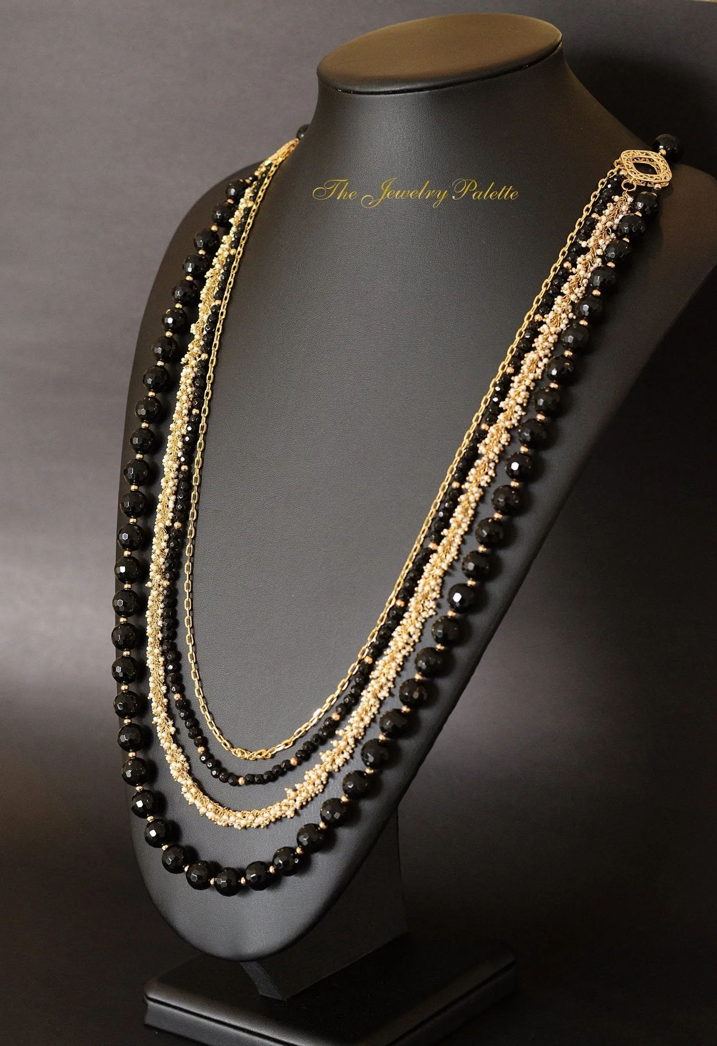 Irene luxurious black and gold four tier necklace